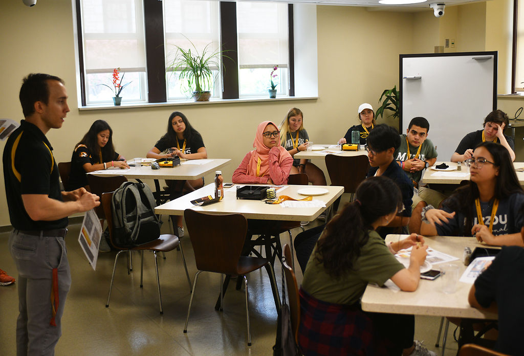 International and local students listen to a presentation about human nutrition from MU PhD student Zach Grunewald